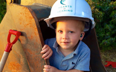 Young child with a hearing aid