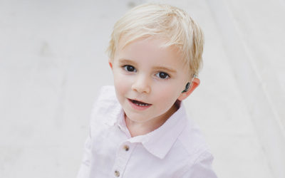 Young child with a hearing aid